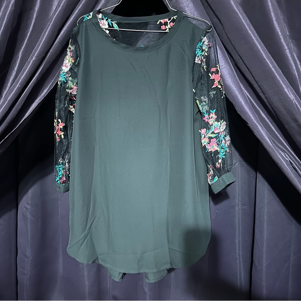 New gorgeous black blouse with see through embroidered floral sleeves. Sz M